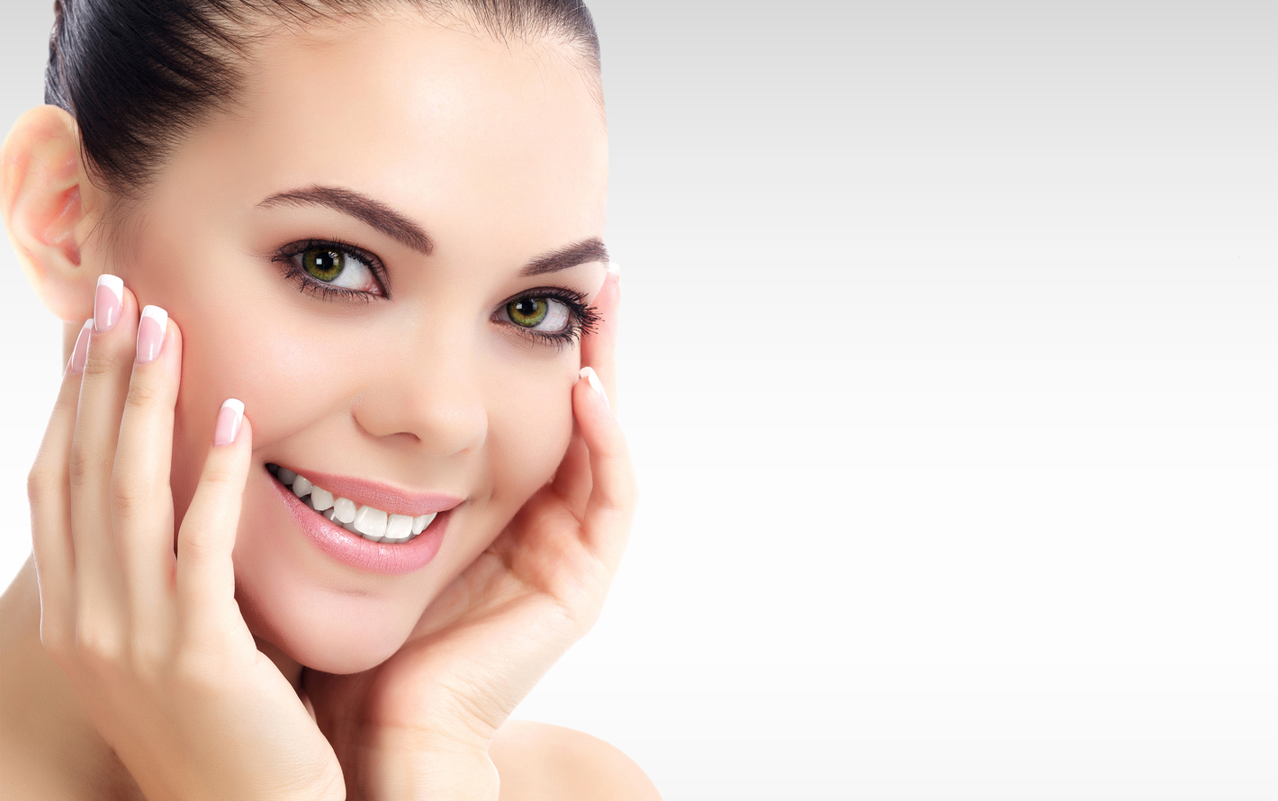 Woman touching her smooth face