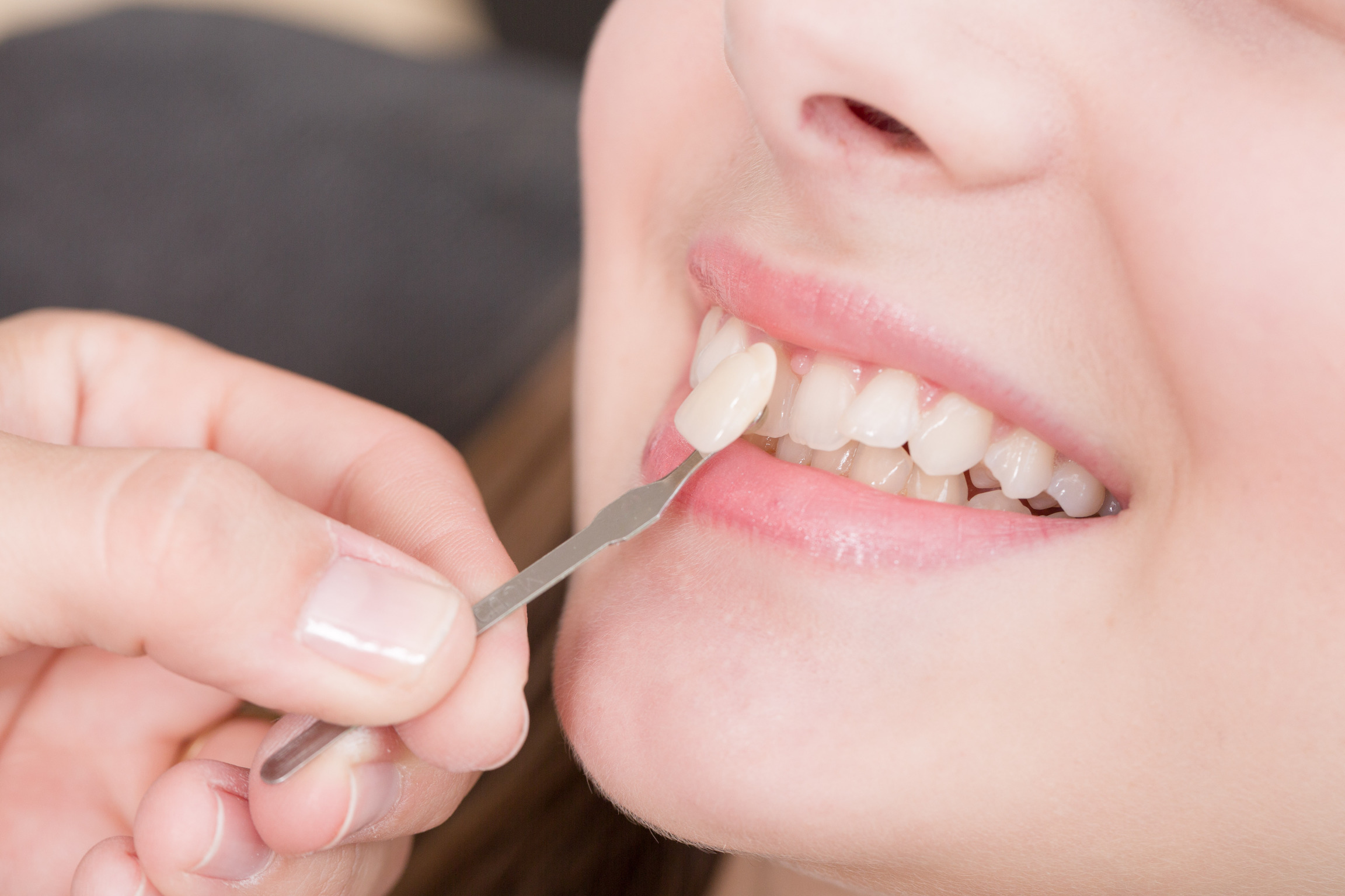 Girl having her tooth checked