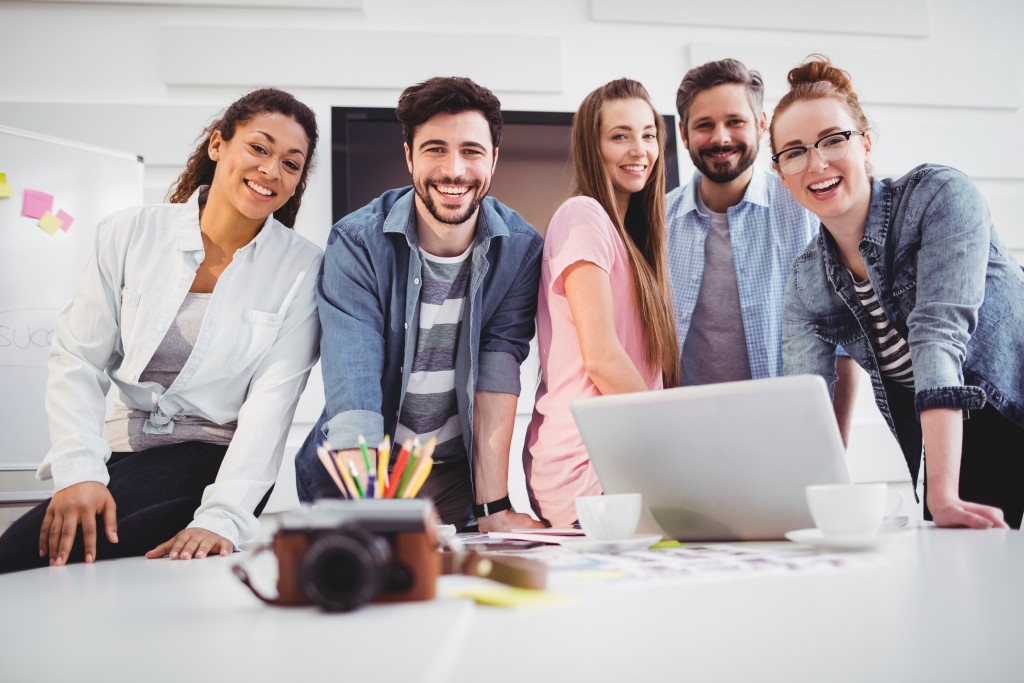Happy employees posing for a picture