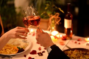 Couple clinking their wine glasses